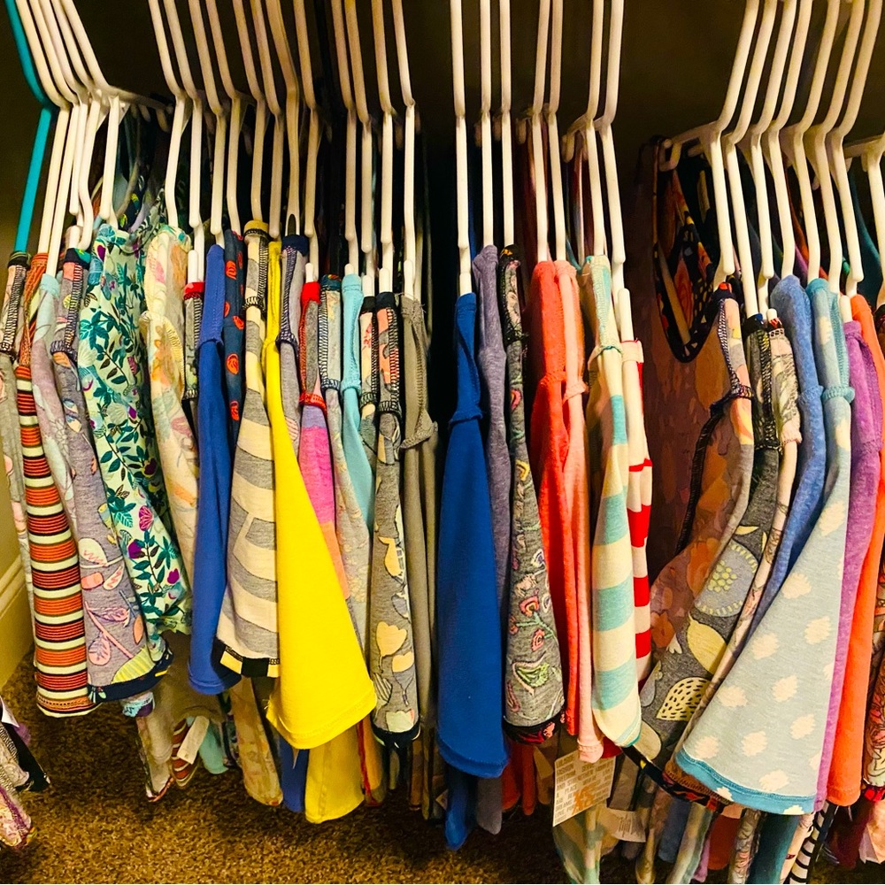 Gigi shirts like new condition, some never worn w/ tags. $15 ea XS & few XXS.